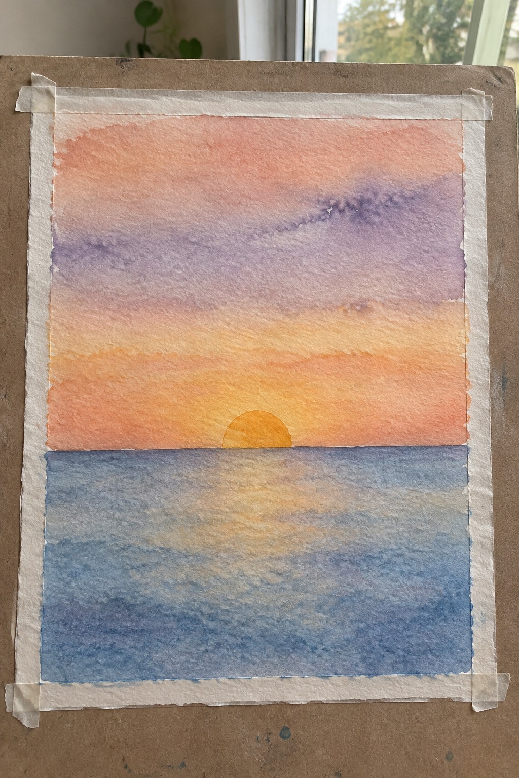 Watercolor sunset over ocean with orange-purple gradient sky and yellow sun on horizon