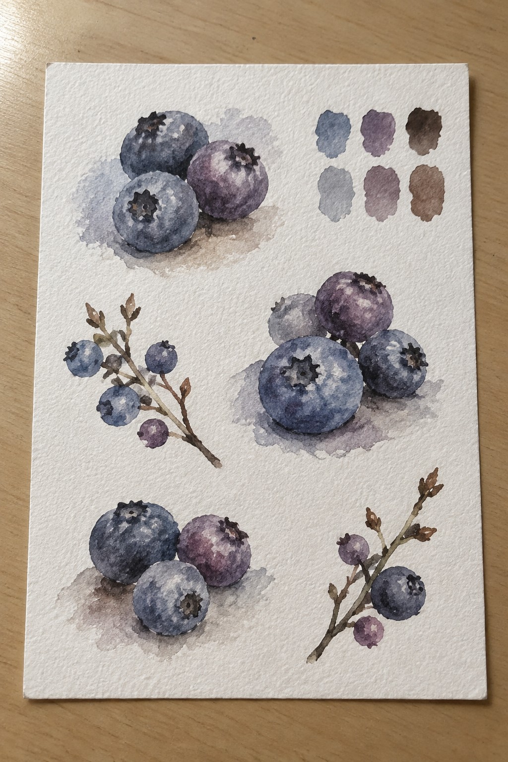 Watercolor painting of multiple blueberry clusters in different arrangements with a six-color swatch grid in the upper right corner.
